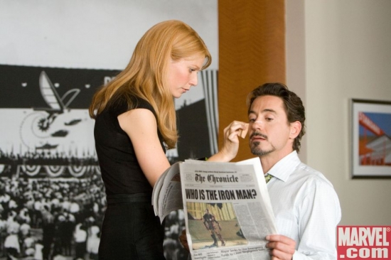 Pepper Potts tends to Tony Stark's wounds
