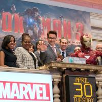 Robert Downey Jr. ringing the opening bell at the NYSE, along with Iron Man and the Marvel staff