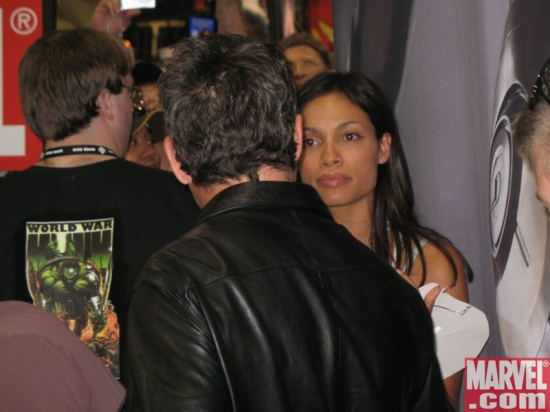 Rosario Dawson stops by the Marvel booth to say hello to Robert Downey Jr.