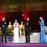 Robert Downey Jr celebrates at the Chinese premier of Marvel's Iron Man 3