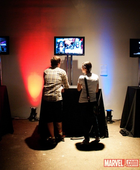 Fans playing Ultimate Marvel Vs. Capcom 3