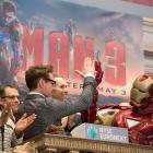 Robert Downey Jr. ringing the opening bell at the NYSE, along with Iron Man and the Marvel staff