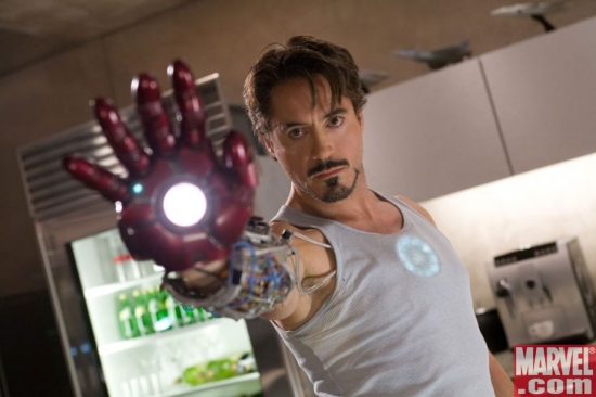 Downey Jr. as Stark, wielding Iron Man's gauntlet