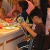 A young fan read's Marvel and William-Sonoma's Custom Comic SPIDER-MAN AND THE AVENGERS!