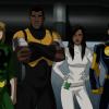 The other heroes stand without their masks