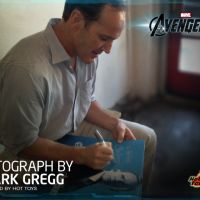 Clark Gregg signing an Agent Coulson figure's package for Hot Toys