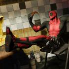 Deadpool enjoys a pizza break while producing his own video game