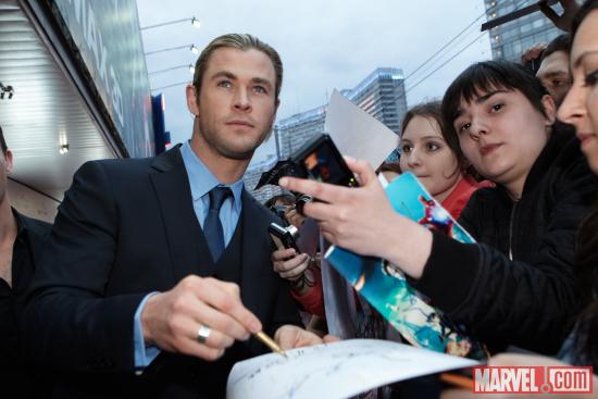 Chris Hemsworth signs autographs at the Moscow premiere of Marvel's The Avengers