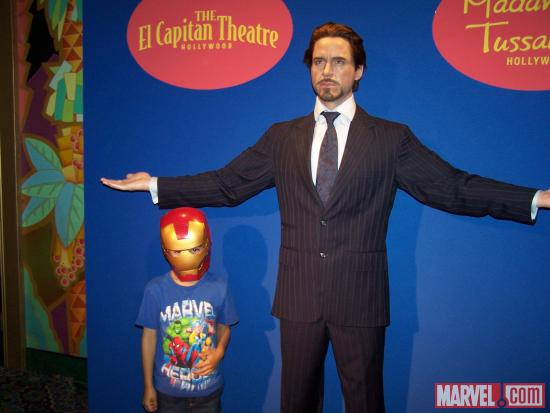 A young fan with Tony Stark's wax figure El Capitan Theatre's midnight screening of Marvel's The Avengers