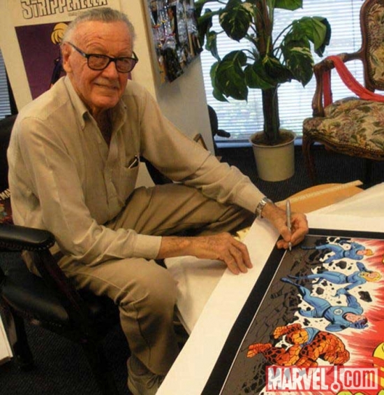 Stan Lee signing a fine art print