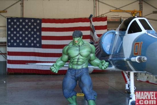 In front of F-14 Tomcat and a giant American flag