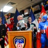 Fire Commissioner Salvatore J. Cassano with the new fire safety comic and Spider-Man, Captain America & Marvel's Bill Rosemann